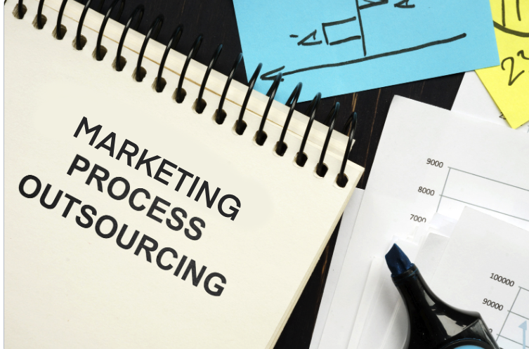 Marketing Process Outsourcing’ written on a notebook